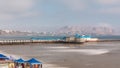 Aerial view of the Pier taken from the pebble beach. Restaurant is located at the end of the pier timelapse. Miraflores