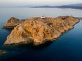 Aerial view of the Pietra Lighthouse and the Genoese tower at sunset. Red Island, Corsica, France Royalty Free Stock Photo