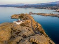 Aerial view of the Pietra Lighthouse and the Genoese tower at sunset. Red Island, Corsica, France Royalty Free Stock Photo