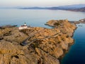 Aerial view of the Pietra Lighthouse and the Genoese tower at sunset. Red Island, Corsica, France