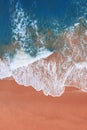 Aerial view of pink beach and blue ocean wave. Royalty Free Stock Photo