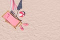 Aerial View of Pink Beach Chair, Umbrella, and Accessories on Sand Royalty Free Stock Photo