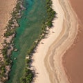 Aerial view of a pink sand beach and red dirt road next to Roebuck Bay in Broome, Western Australia. made with