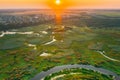 Aerial View Of Plain With Green Forest Woods And River Landscape In Sunny Spring Evening. Top View Of Beautiful European Royalty Free Stock Photo