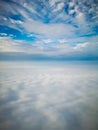 Aerial view from plane to morning sunrise over clouds Royalty Free Stock Photo