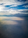 Aerial view from plane to morning sunrise over clouds Royalty Free Stock Photo