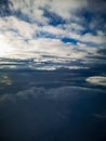 Aerial view from plane to morning sunrise over clouds Royalty Free Stock Photo