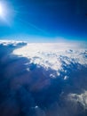 Aerial view from plane to morning sunrise over clouds Royalty Free Stock Photo