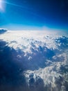 Aerial view from plane to morning sunrise over clouds Royalty Free Stock Photo