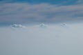 Aerial view from plane window with blue sky and white clouds Royalty Free Stock Photo