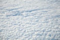 Aerial view from plane window with blue sky and white clouds Royalty Free Stock Photo