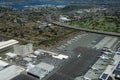 Aerial view of planes, helicopters, and cars parked by buildings