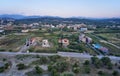 Aerial view on Platanias beachfront area with villas and road at evening time. Crete, Greece