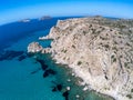 Aerial view of Plathiena beach with cliffs and vegetation