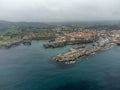 Aerial view on Playa de Toro and Llanes old harbour, Green coast of Asturias, North Spain with sandy beaches, cliffs, hidden caves