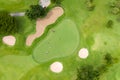 Aerial view of players on a green golf course. Golfer playing on putting green on a summer day. People lifestyle relaxing time in Royalty Free Stock Photo