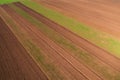 Aerial view of plowed cultivated land, agricultural field from drone pov Royalty Free Stock Photo