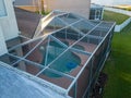 Aerial view of pool screen enclosure surrounded by trees Royalty Free Stock Photo