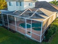 Aerial view of pool screen enclosure surrounded by trees Royalty Free Stock Photo
