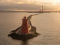 Aerial view of Poolbeg Lighthouse the famous red landmark in Dublin Harbor Ireland seen by drone at sunset Royalty Free Stock Photo