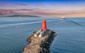 Aerial view of Poolbeg Lighthouse the famous red landmark in Dublin Harbor Ireland seen by drone at sunset Royalty Free Stock Photo