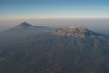 Aerial view of the Popocatepetl and Iztaccihuatl volcanos just after sunrise Royalty Free Stock Photo