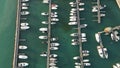 Aerial view of the port of Lake Garda. Yacht Club. Moored yachts and motorized private boats. The pier is made of wood Royalty Free Stock Photo