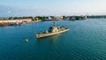 Aerial view of a Portuguese ship, named Zaire, sailing across the open ocean on a sunny day.