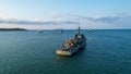 Aerial view of a Portuguese ship, named Zaire, sailing across the open ocean on a sunny day.