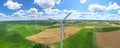 Aerial view of powerful Wind turbine farm for energy production on beautiful cloudy sky at highland. Wind power turbines Royalty Free Stock Photo