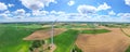 Aerial view of powerful Wind turbine farm for energy production on beautiful cloudy sky at highland. Wind power turbines Royalty Free Stock Photo