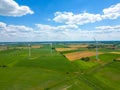 Aerial view of powerful Wind turbine farm for energy production on beautiful cloudy sky at highland. Wind power turbines Royalty Free Stock Photo