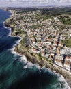 Aerial view of Praia das Macas little township along south Portuguese coastline facing the Atlantic Ocean, Colares, Portugal