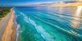 Aerial view of a pristine beach and ocean at sunrise, showing rolling waves and a sandy shore with sparse footprints. Generative Royalty Free Stock Photo