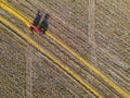 Aerial view of pumpkin harvest with a tractor, Modern pumpkin seed farming