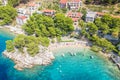 Aerial view of Punta Rata beach with boats and azure sea in Brela, Croatia, Dalmatia, Croatian azure coast