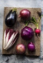 Aerial view of purple vegetable group collection on wooden table