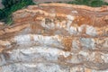 Aerial view of the quarry, beautiful orange patterns and overhanging rocks in a copper-magnesium quarry