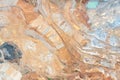 Aerial view of the quarry, beautiful orange patterns and overhanging rocks in a copper-magnesium quarry