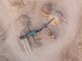 Aerial view of a quarry with conveyor belt and wheel loader - stones and sands for construction - top view , open pit mine, extrac