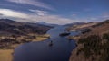 aerial view of Queens View, Loch Tummel, Scotland, featuring a river cascading through green fields Royalty Free Stock Photo