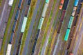 Aerial view of rail sorting freight station with railway cars, with many rail tracks railroad. Heavy industry landscape on evening