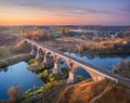 Aerial view of railroad bridge and river at sunset in autumn Royalty Free Stock Photo