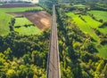 Aerial view of the railroad tracks for high-speed trains on the flyover. Panoramic autumn view of the surrounding forest Royalty Free Stock Photo