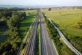Aerial view, railway and road in rural landscape.