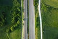 Aerial view, railway and road in rural landscape.