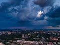 Aerial view on rain clouds at sunset over the city Royalty Free Stock Photo