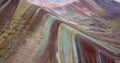 Aerial view of the Rainbow mountain and Andes peaks of Peru