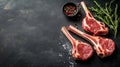 Aerial view of raw lamb chops and fresh mutton cutlets on ribs against a dark backdrop Royalty Free Stock Photo