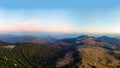 Aerial view of the Recreation Mountain Pysany kamin in Carpathian mountains. autumn. Pine forest, houses on the peaks, yellow